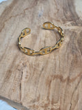 Bracelet manchette à mailles marines dorées