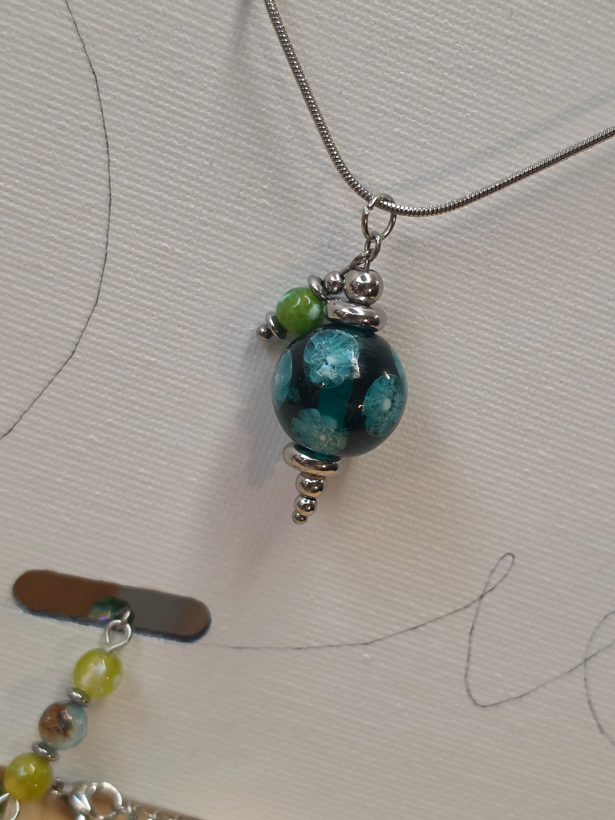 Parure Pendule (acier inox argenté)